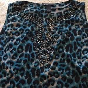 Dress up or down Inc sleeveless top.